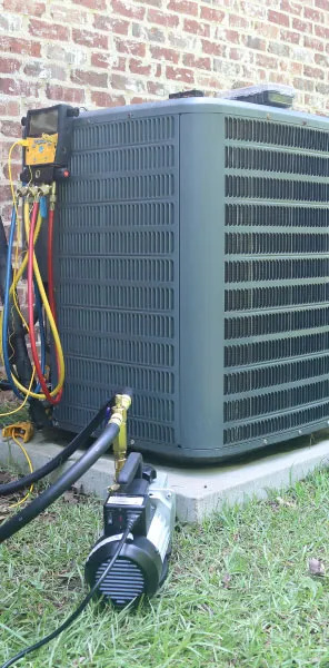 Hobbs Heating and Air technician performing scheduled HVAC maintenance